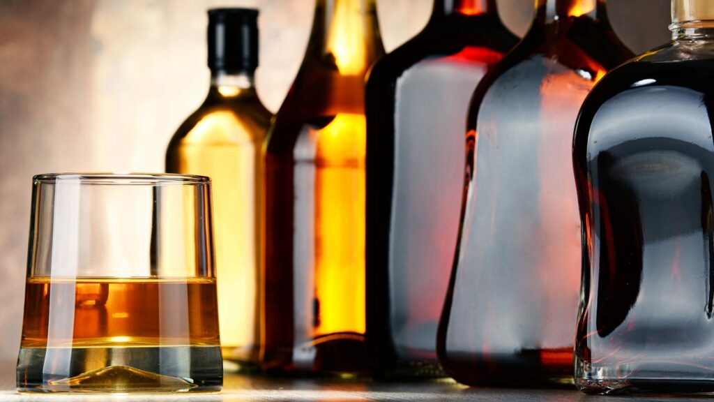 Rum bottles and a glass of rum