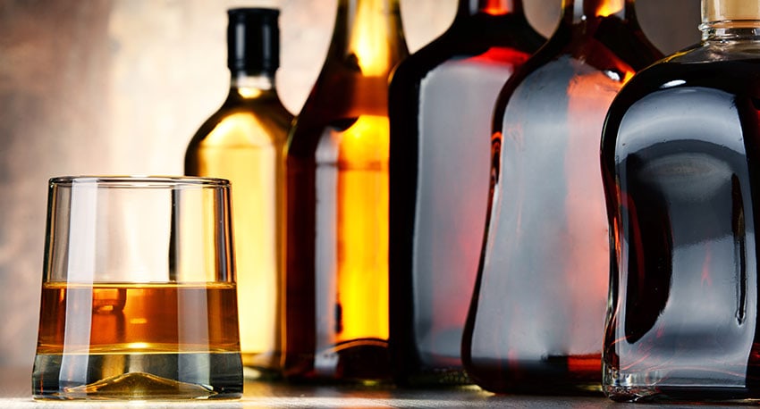 Rum bottles and a glass of rum
